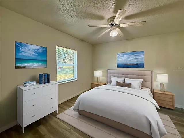 a bedroom with a large bed and a window