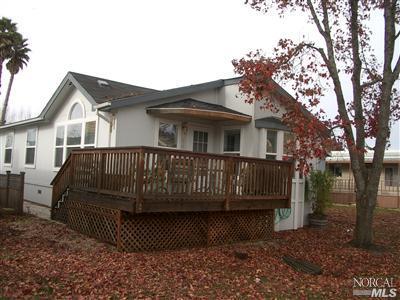 154 Walnut Circle, Unit 212 Rohnert Park, CA 94928 - Photo 1 of 12 Great deck at the front door faces the interior walking path.