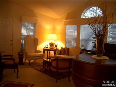 154 Walnut Circle, Unit 212 Rohnert Park, CA 94928 - Photo 2 of 12 Early evening in the living room is accented by cathedral ceilings, dual pane windows, custom window cornices. Plenty of room for a grand piano.