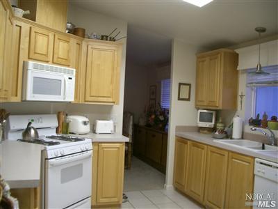 154 Walnut Circle, Unit 212 Rohnert Park, CA 94928 - Photo 6 of 12 Spacious kitchen with skylight, tile flooring, birch cabinets, upgraded appliances & fixtures.