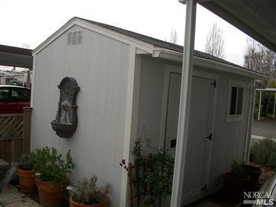 154 Walnut Circle, Unit 212 Rohnert Park, CA 94928 - Photo 9 of 12 Solid wood shed has electricity, is secure and attractive.
