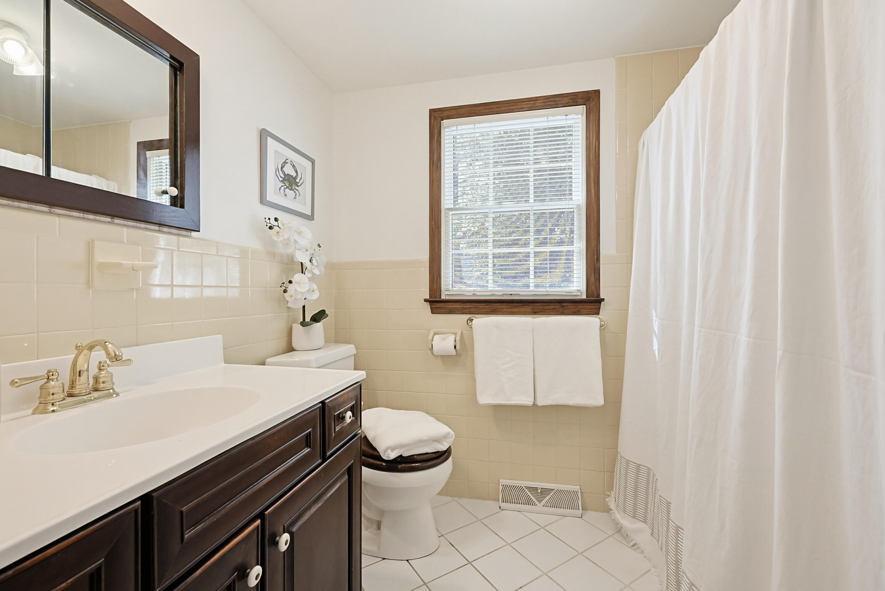 556 Cotuit Road Mashpee, MA 02649 - Photo 21 of 45 a bathroom with a sink toilet vanity and tub