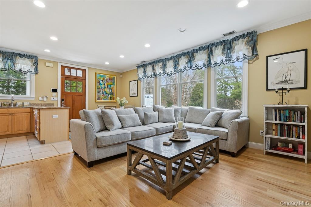15 Carter Road Hampton Bays, NY 11946 - Photo 19 of 47 Living room featuring ornamental molding, recessed lighting, and light wood finished floors