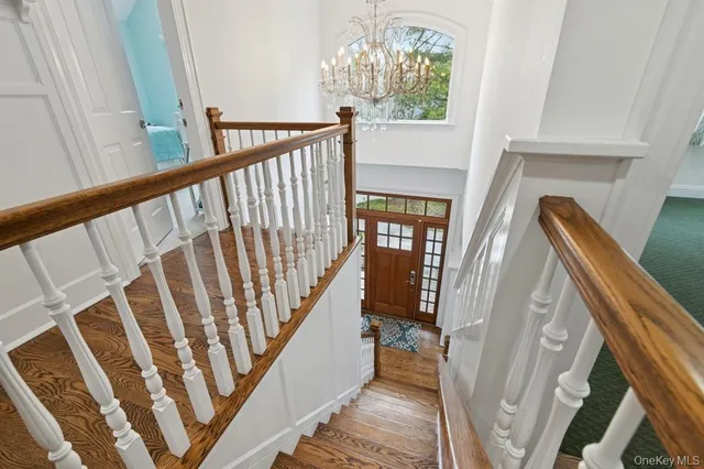 a view of stairs and with wooden floor