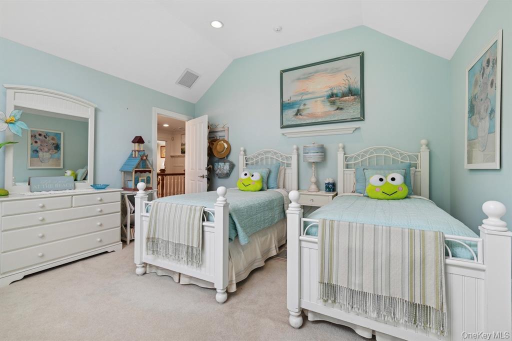 15 Carter Road Hampton Bays, NY 11946 - Photo 29 of 47 Carpeted bedroom with lofted ceiling and recessed lighting