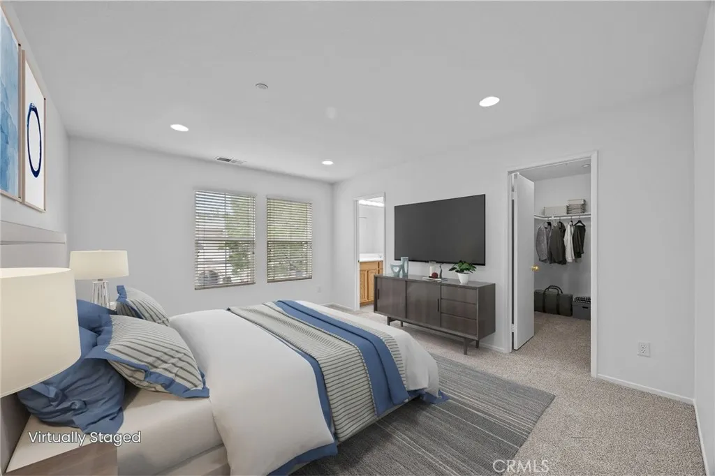 7353 Ellena West Street West, Unit 112 Rancho Cucamonga, CA 91730 - Photo 17 of 38 a bedroom with a bed and a television