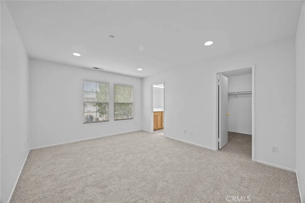 7353 Ellena West Street West, Unit 112 Rancho Cucamonga, CA 91730 - Photo 20 of 38 a view of an empty room with a window