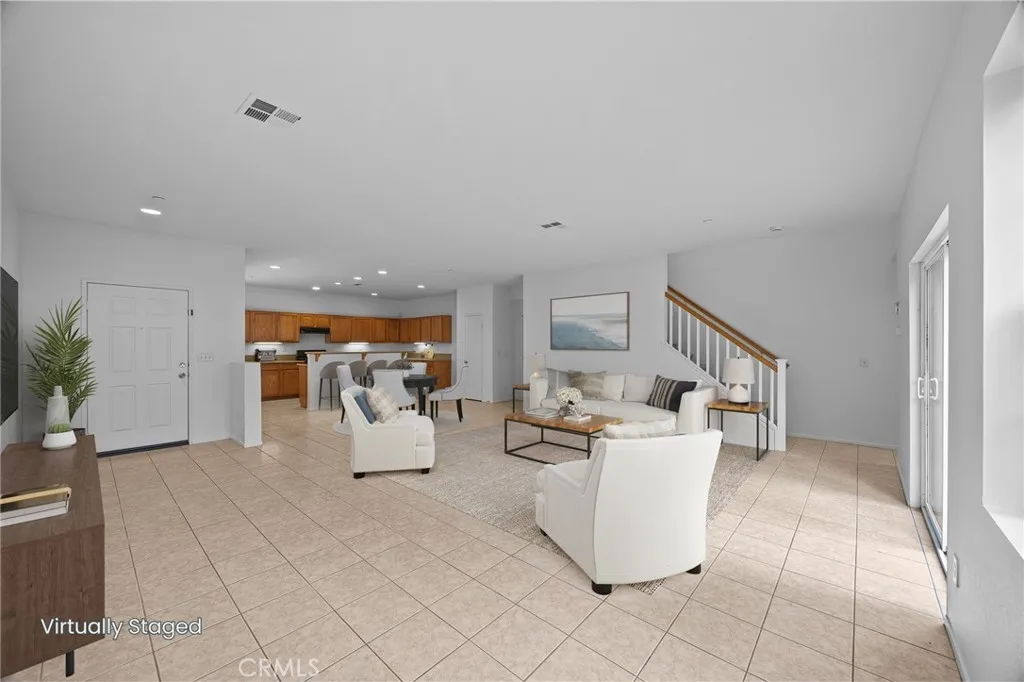 7353 Ellena West Street West, Unit 112 Rancho Cucamonga, CA 91730 - Photo 5 of 38 a living room with furniture and white walls