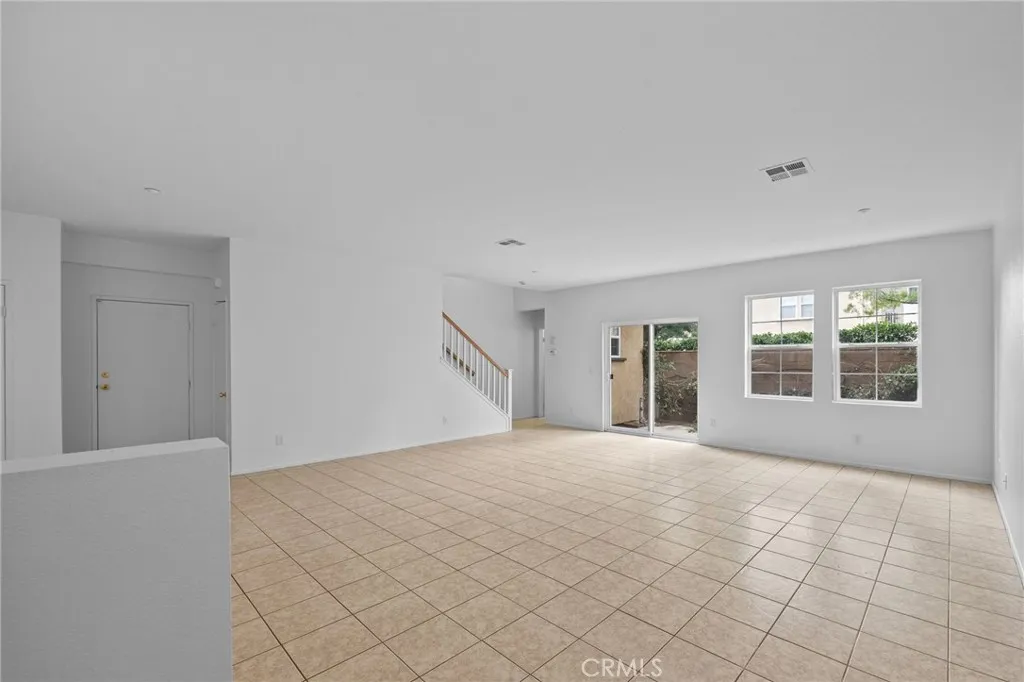 7353 Ellena West Street West, Unit 112 Rancho Cucamonga, CA 91730 - Photo 6 of 38 a view of an empty room with a window