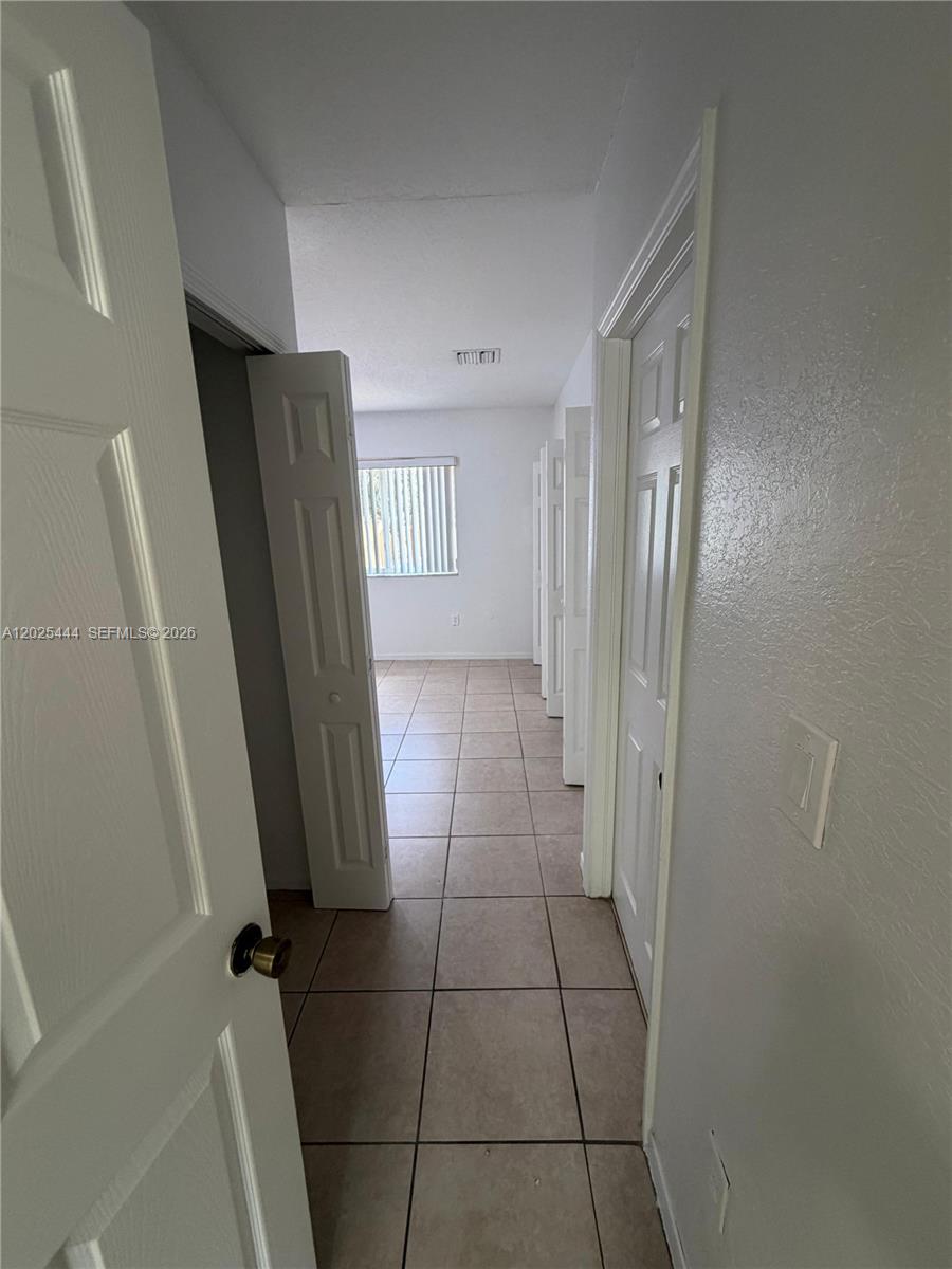681 Southwest 7th Street, Unit 681 Florida City, FL 33034 - Photo 11 of 16 a bathroom with a sink a toilet and a shower