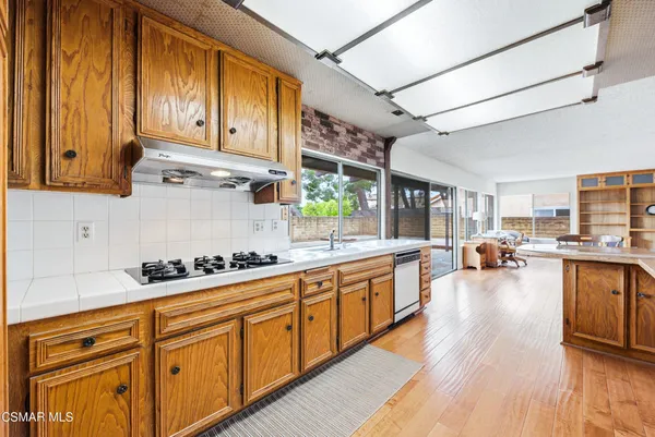 a kitchen with stainless steel appliances cabinets and a counter top