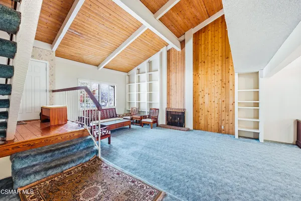 a view of livingroom with furniture and staircase