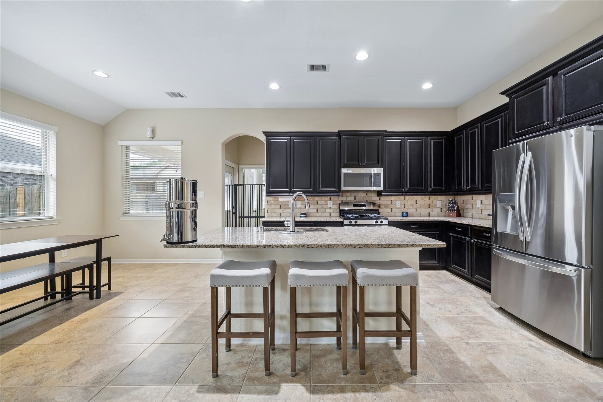 6723 Hunters Way Lane Baytown, TX 77521 - Photo 3 of 16 Kitchen island with a built-in sink ample space for food prep or casual seating.