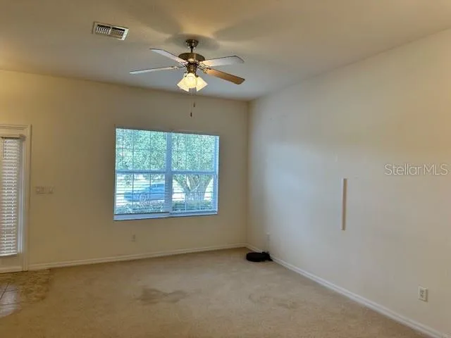 a view of an empty room with a window