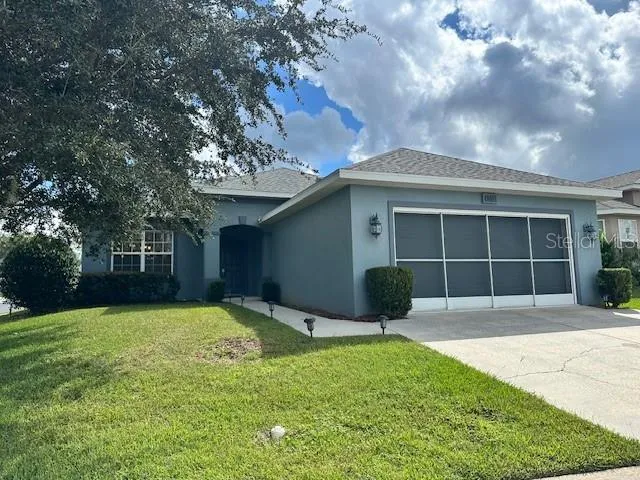 a front view of a house with a yard and porch
