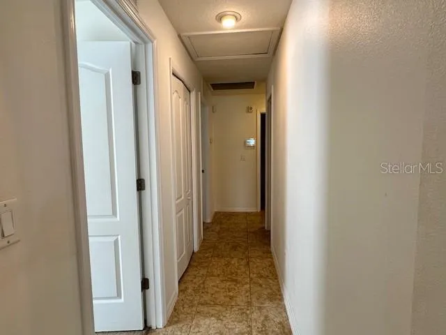 a view of an empty room with a large window