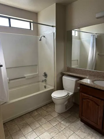 a bathroom with a toilet a sink and bathtub