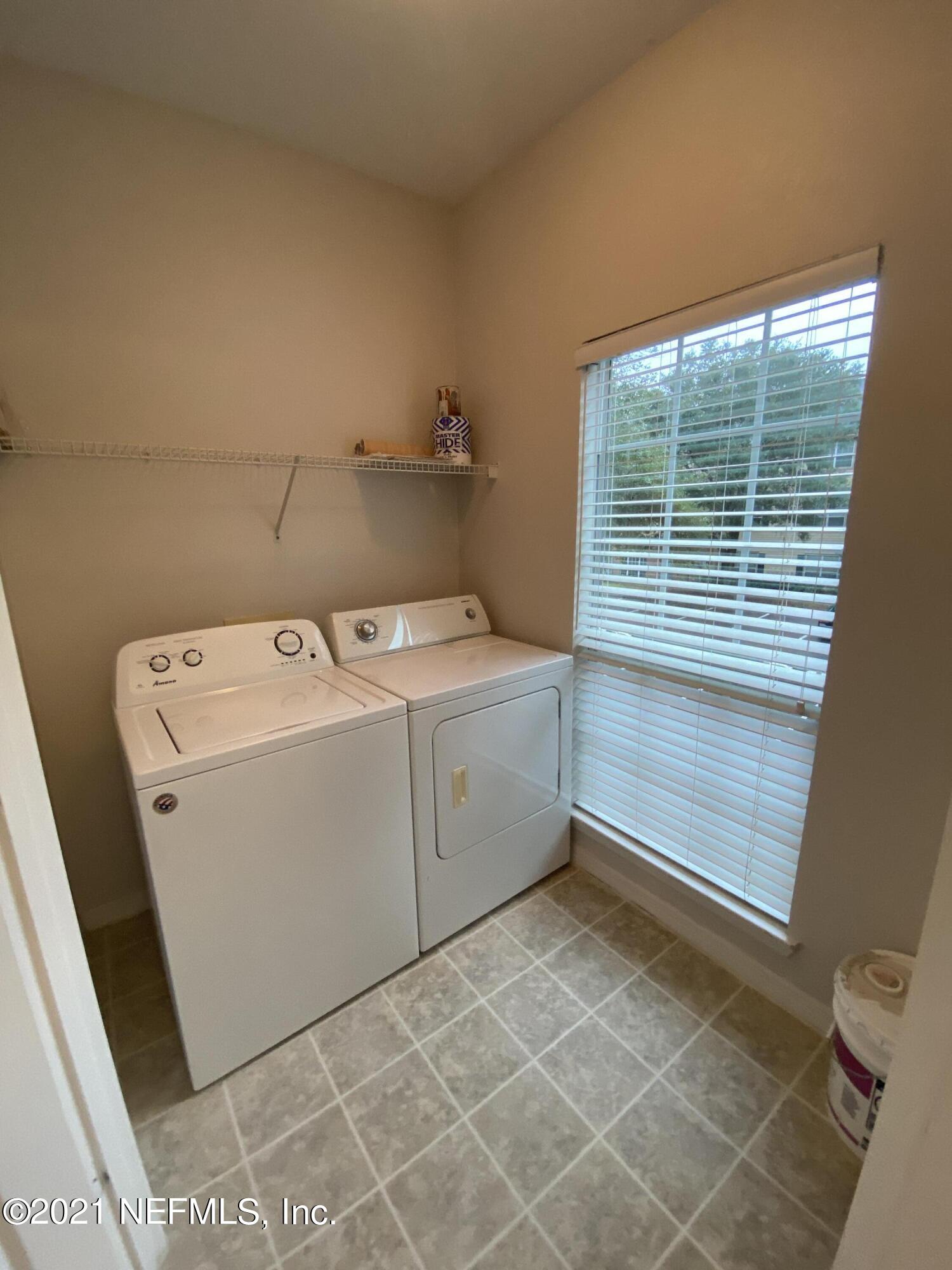 7800 Point Meadows Drive, Unit 422 Jacksonville, FL 32256 - Photo 28 of 38 a utility room with dryer and washer