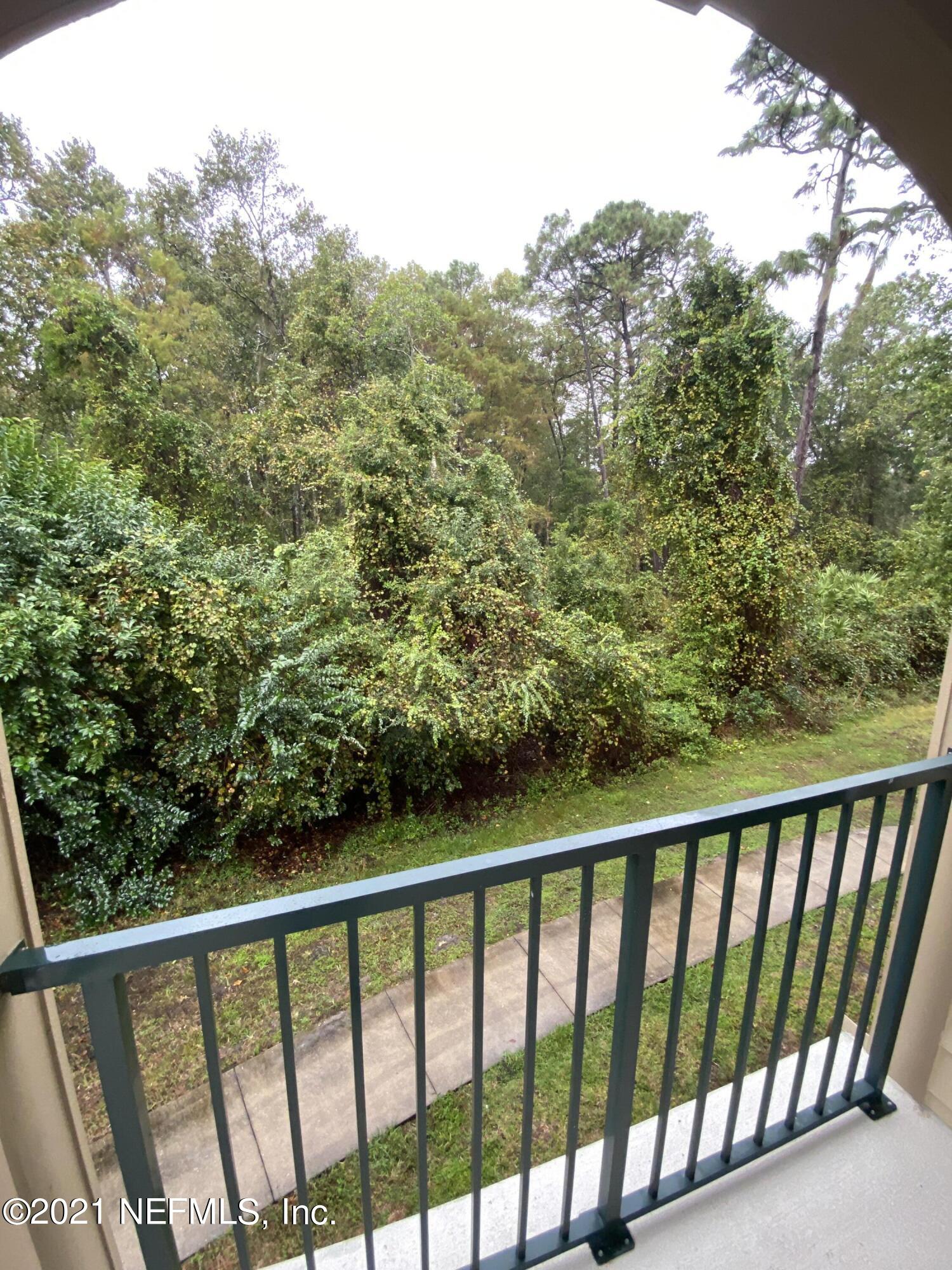 7800 Point Meadows Drive, Unit 422 Jacksonville, FL 32256 - Photo 34 of 38 a view of a balcony with outdoor space