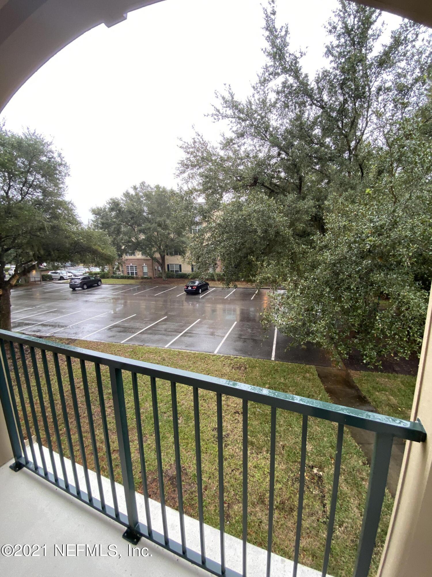 7800 Point Meadows Drive, Unit 422 Jacksonville, FL 32256 - Photo 35 of 38 a view of a balcony with yard