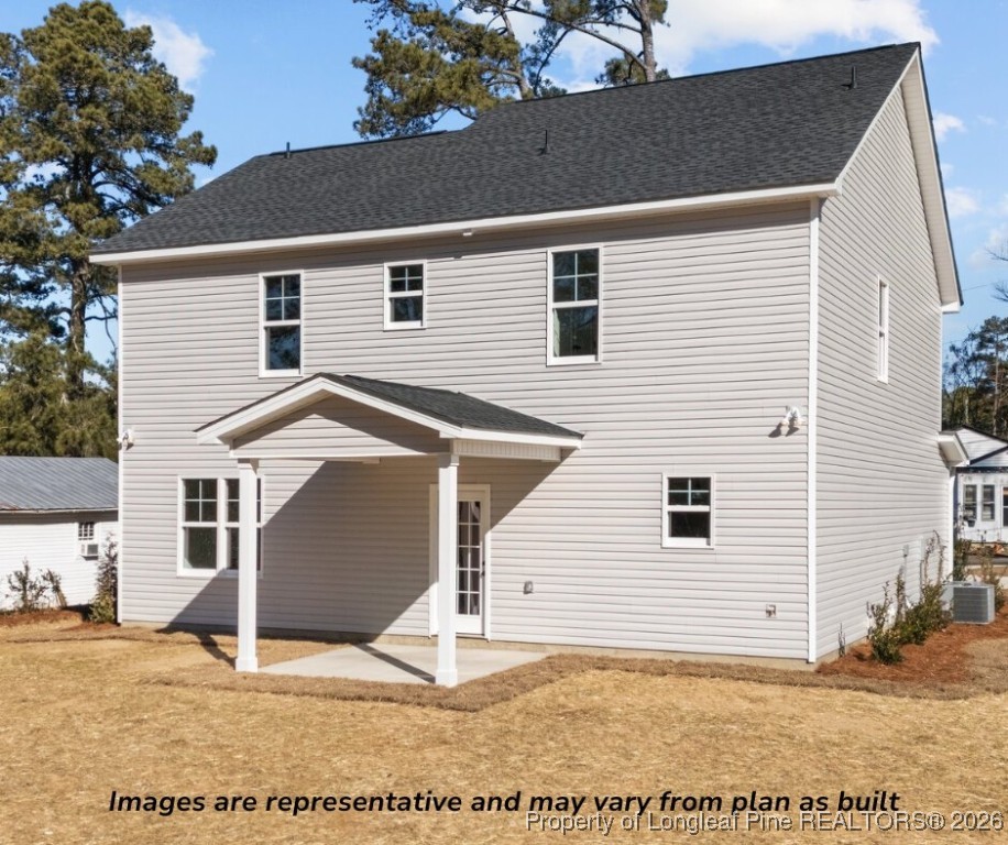 9790 Rockfish Road Raeford, NC 28376 - Photo 7 of 8 a view of a house with a backyard
