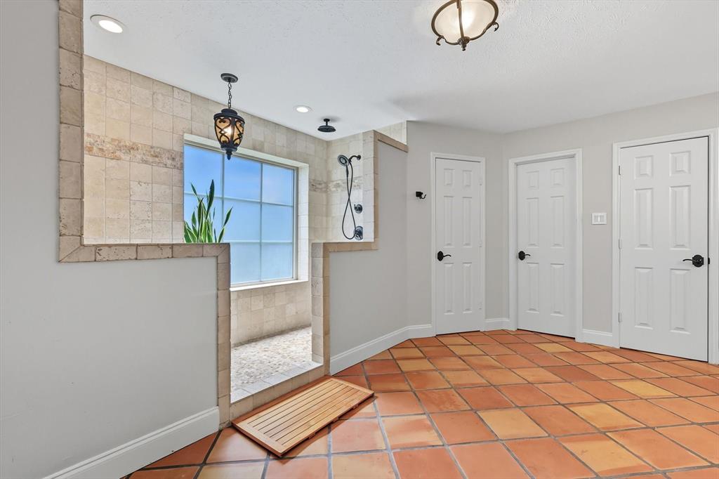 7632 Tallow Drive Irving, TX 75063 - Photo 14 of 40 Primary bathroom with dual showers, dual vanity, and dual closets