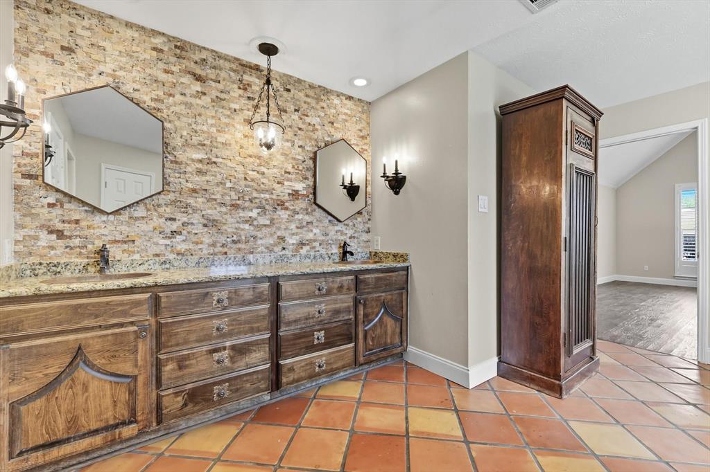 7632 Tallow Drive Irving, TX 75063 - Photo 15 of 40 Primary bathroom with dual showers, dual vanity, and dual closets
