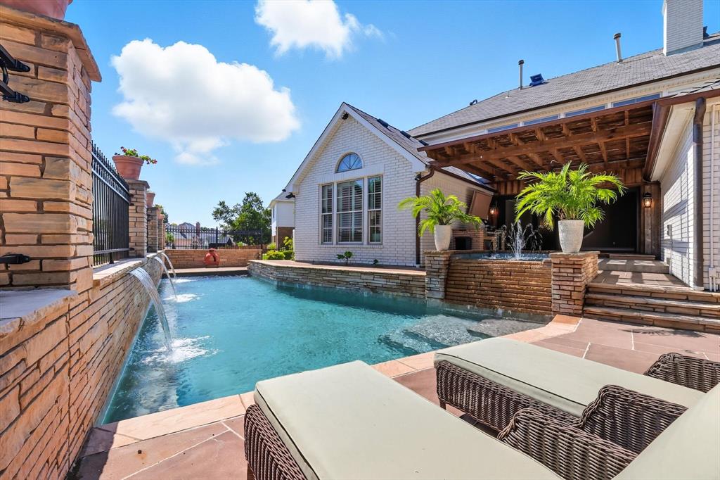 7632 Tallow Drive Irving, TX 75063 - Photo 34 of 40 Pool with elevated spa and water freatures