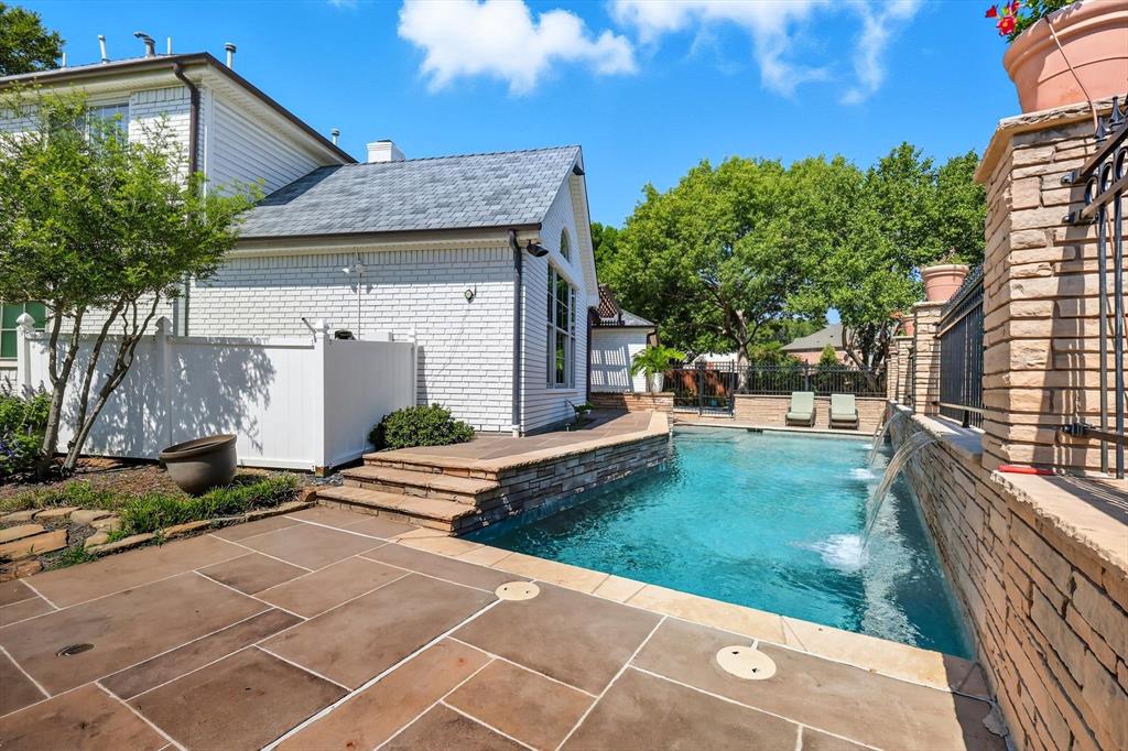 7632 Tallow Drive Irving, TX 75063 - Photo 35 of 40 Pool with elevated spa and water freatures