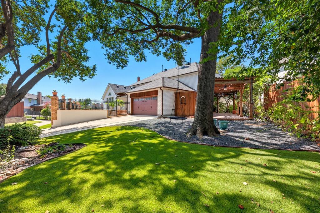 7632 Tallow Drive Irving, TX 75063 - Photo 36 of 40 Side yard with turf and side yard pergola