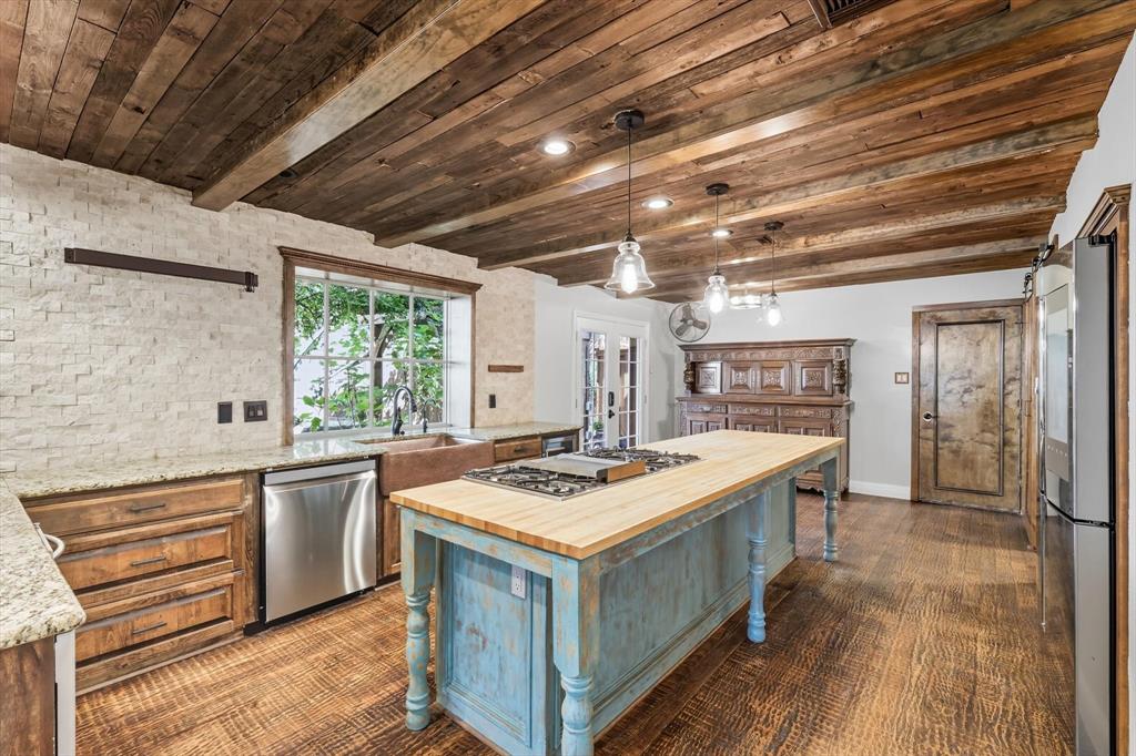 7632 Tallow Drive Irving, TX 75063 - Photo 6 of 40 Kitchen featuring butcher block island and stainless appliances