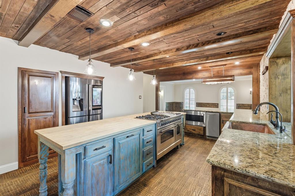 7632 Tallow Drive Irving, TX 75063 - Photo 8 of 40 Kitchen featuring butcher block island and stainless appliances