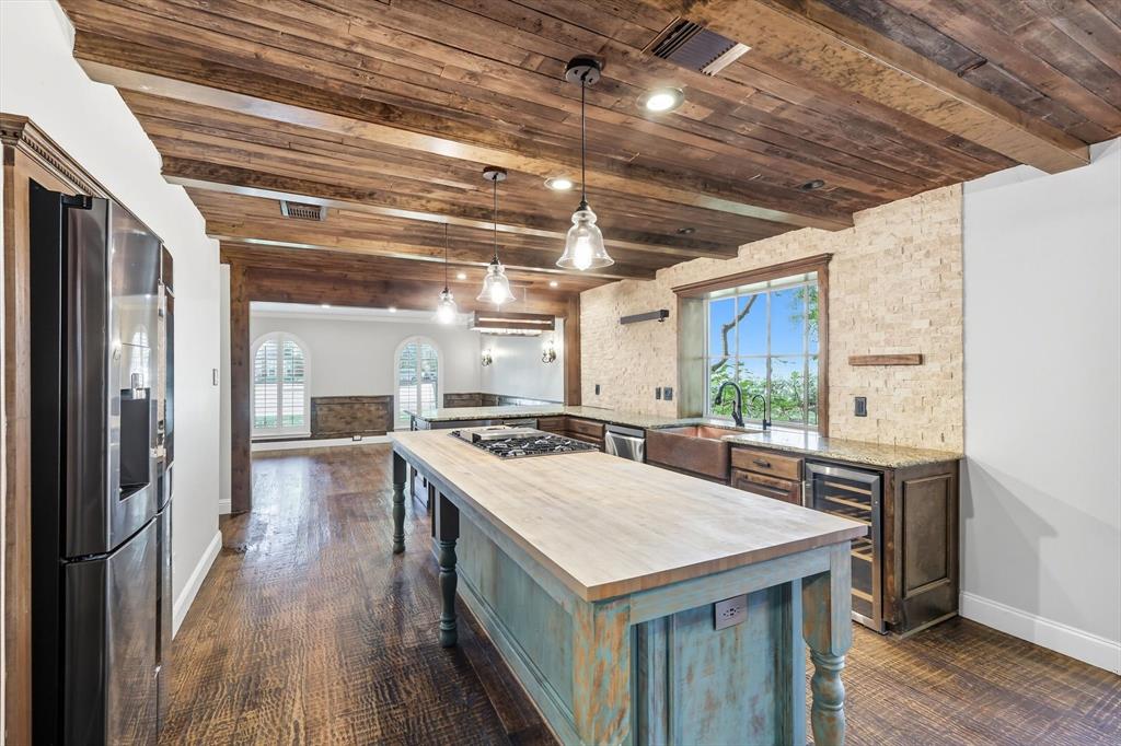 7632 Tallow Drive Irving, TX 75063 - Photo 9 of 40 Kitchen featuring butcher block island and stainless appliances