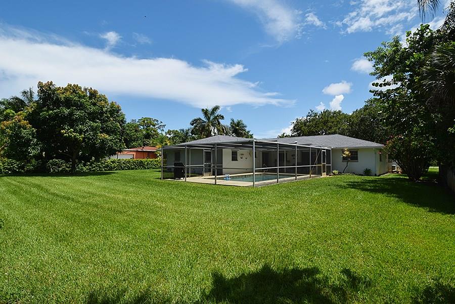 1975 Northwest Fork Road Stuart, FL 34994 - Photo 32 of 35 a view of a house with a big yard
