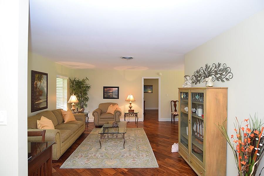 1975 Northwest Fork Road Stuart, FL 34994 - Photo 5 of 35 a living room with furniture and a wooden floor