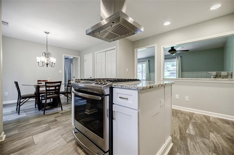 2343 Hunting Valley Drive Decatur, GA 30033 - Photo 18 of 71 a kitchen with stainless steel appliances granite countertop a stove and a sink