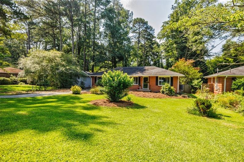 2343 Hunting Valley Drive Decatur, GA 30033 - Photo 2 of 71 a front view of a house with swimming pool