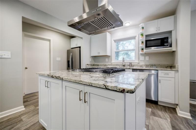 2343 Hunting Valley Drive Decatur, GA 30033 - Photo 21 of 71 a kitchen with stainless steel appliances granite countertop a sink and a stove