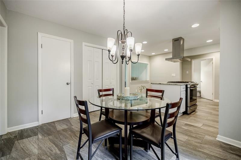 2343 Hunting Valley Drive Decatur, GA 30033 - Photo 24 of 71 a view of a dining room with furniture and wooden floor