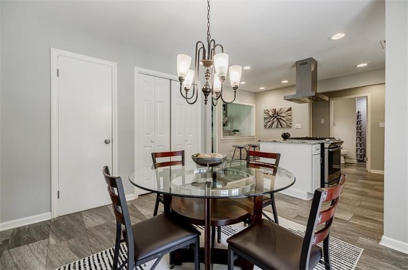 2343 Hunting Valley Drive Decatur, GA 30033 - Photo 27 of 71 a view of a dining room with furniture and wooden floor