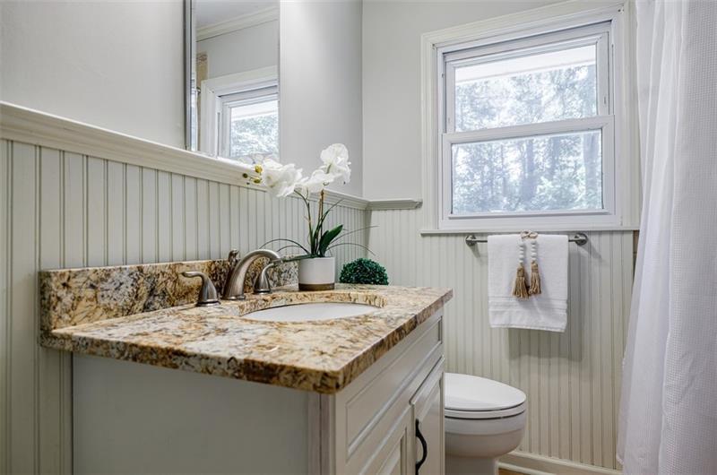 2343 Hunting Valley Drive Decatur, GA 30033 - Photo 33 of 71 a bathroom with a granite countertop sink and a toilet