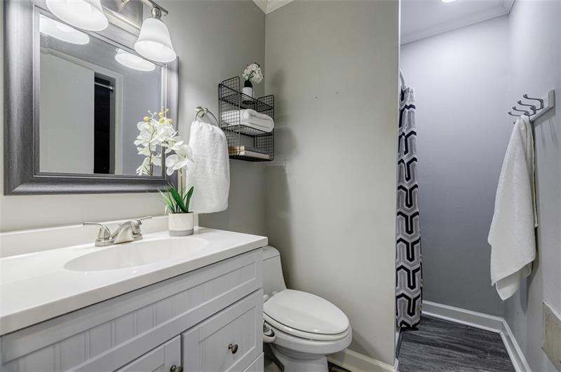 2343 Hunting Valley Drive Decatur, GA 30033 - Photo 38 of 71 a bathroom with a sink a toilet and a mirror