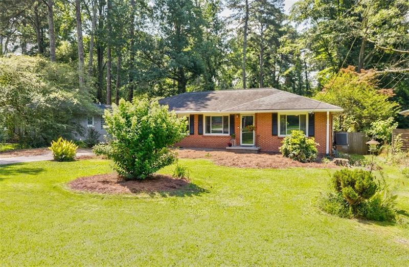 2343 Hunting Valley Drive Decatur, GA 30033 - Photo 4 of 71 a front view of a house with a yard
