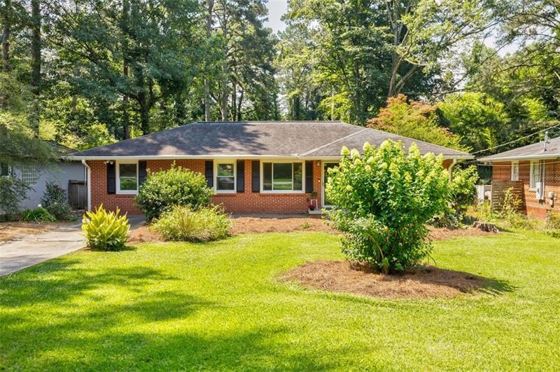2343 Hunting Valley Drive Decatur, GA 30033 - Photo 5 of 71 a front view of a house with a yard and trees