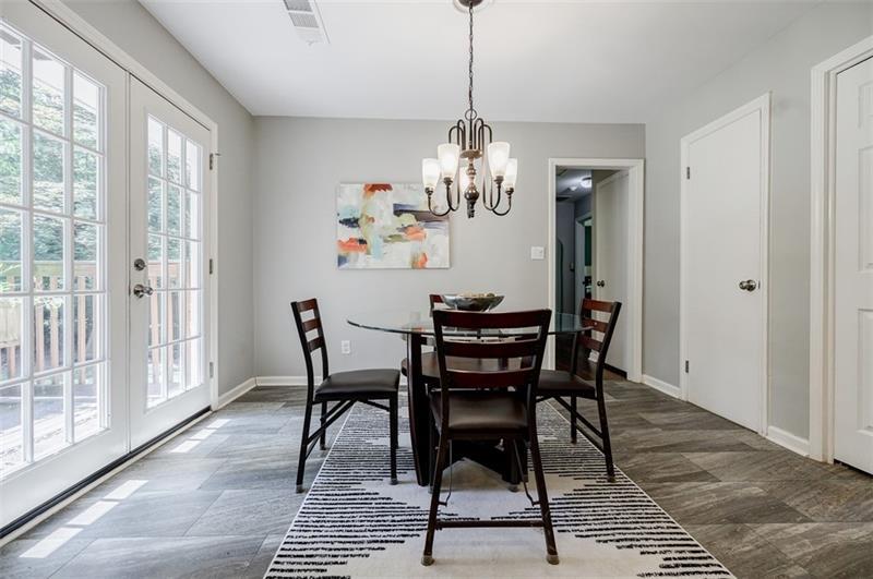2343 Hunting Valley Drive Decatur, GA 30033 - Photo 71 of 71 a view of a dining room with furniture wooden floor and a chandelier