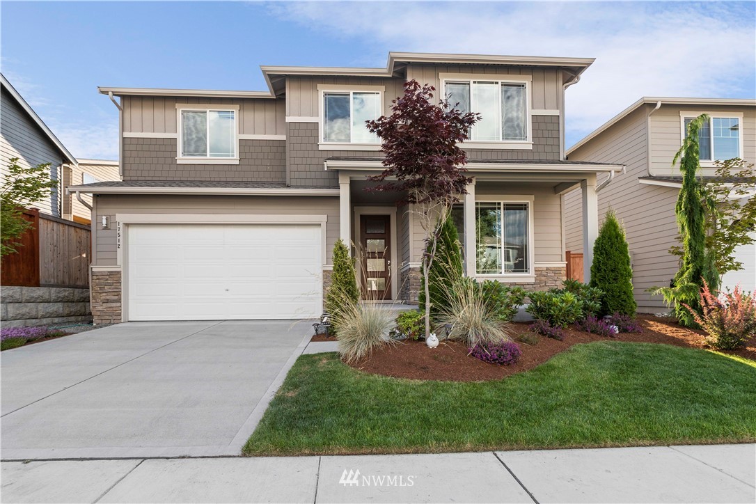 17512 Meridian Place West Bothell, WA 98012 - Photo 2 of 28 a view of a house with a yard and plants