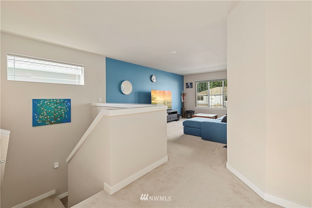 17512 Meridian Place West Bothell, WA 98012 - Photo 12 of 28 a living room with furniture and a couch