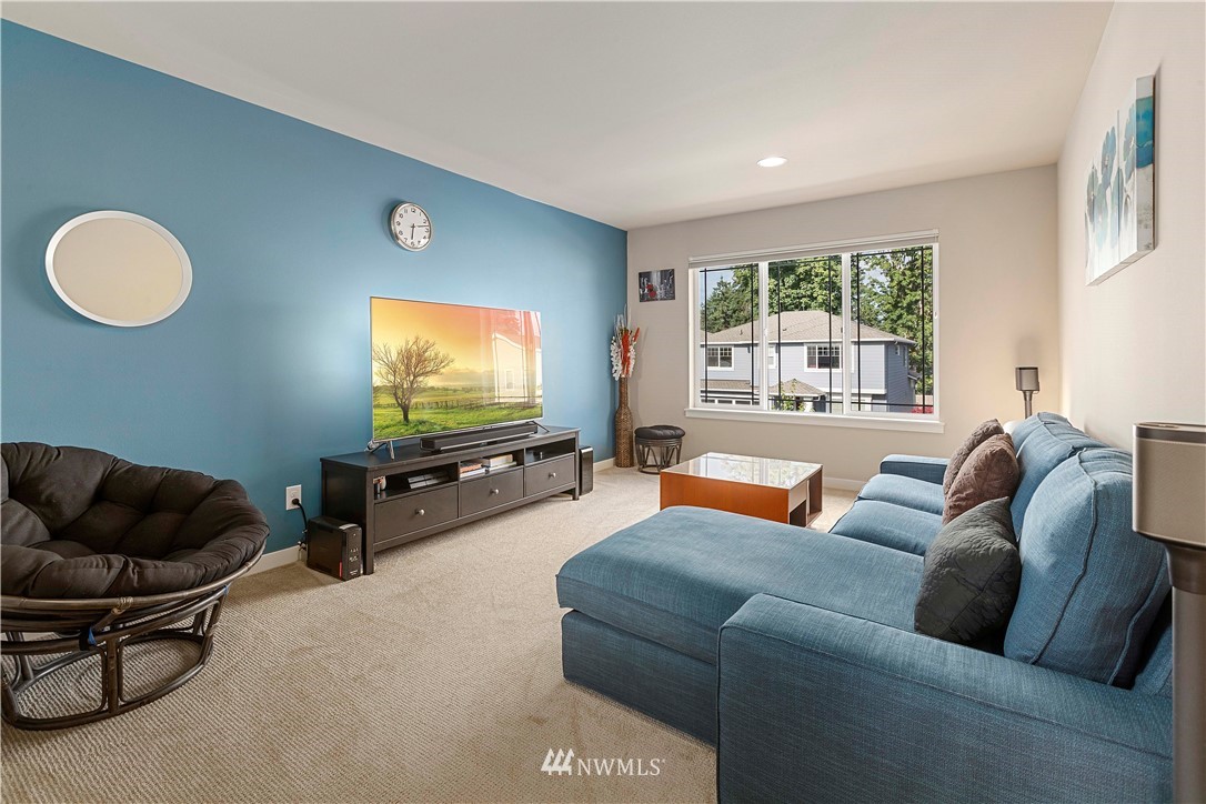 17512 Meridian Place West Bothell, WA 98012 - Photo 13 of 28 a living room with furniture and a flat screen tv