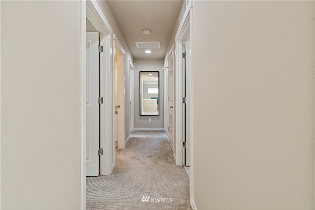 17512 Meridian Place West Bothell, WA 98012 - Photo 14 of 28 a view of a hallway with wooden shelves