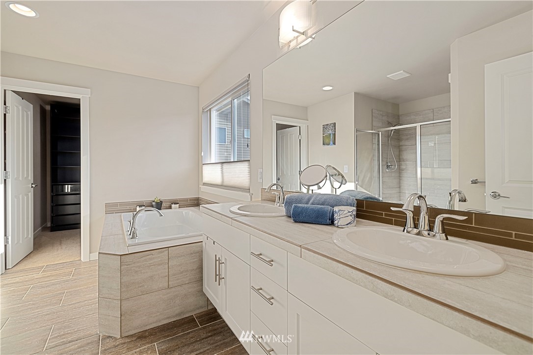17512 Meridian Place West Bothell, WA 98012 - Photo 16 of 28 a en suite bathroom with double sink and a mirror